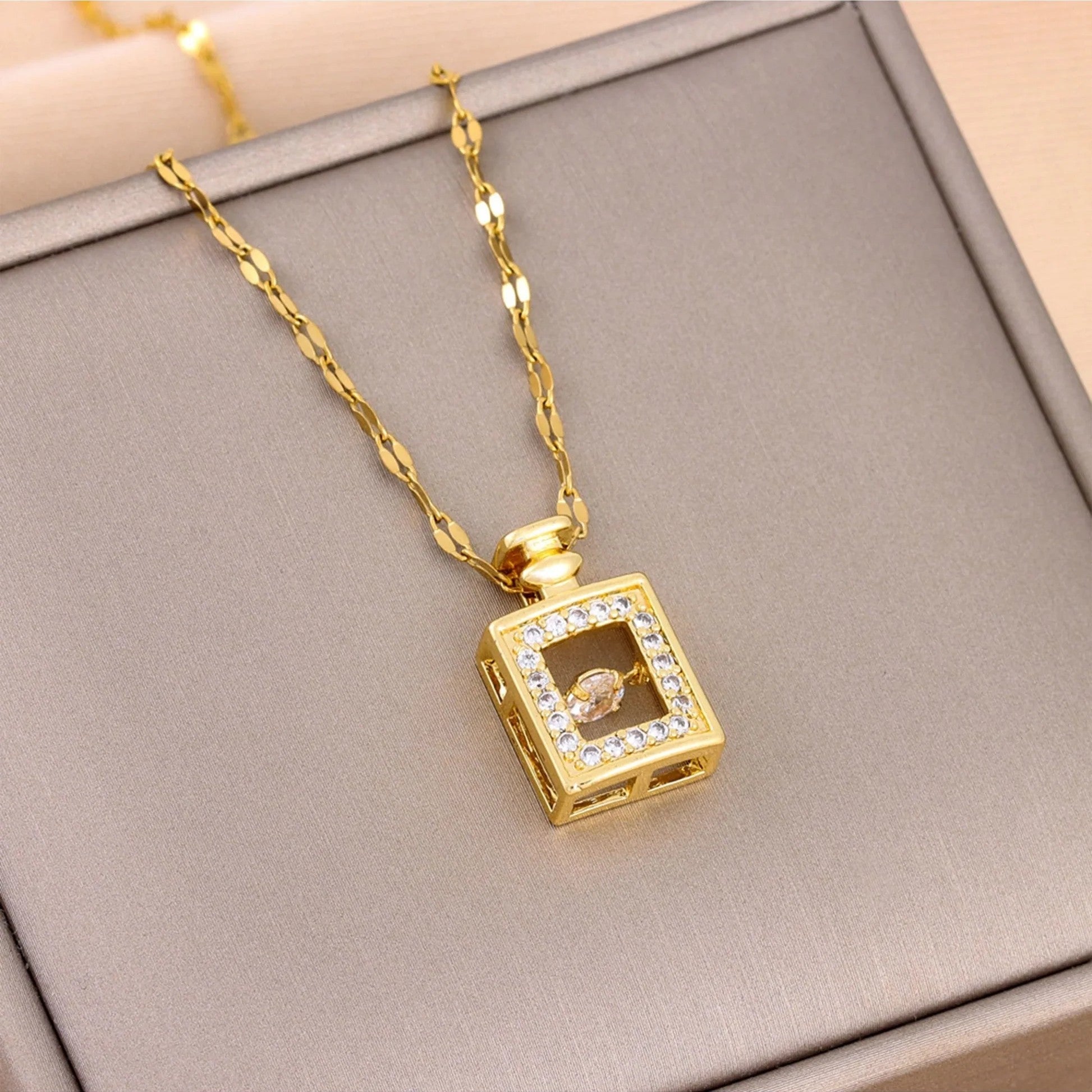 Jazbaat Golden Perfume Bottle Dancing Diamond Pendant Necklace