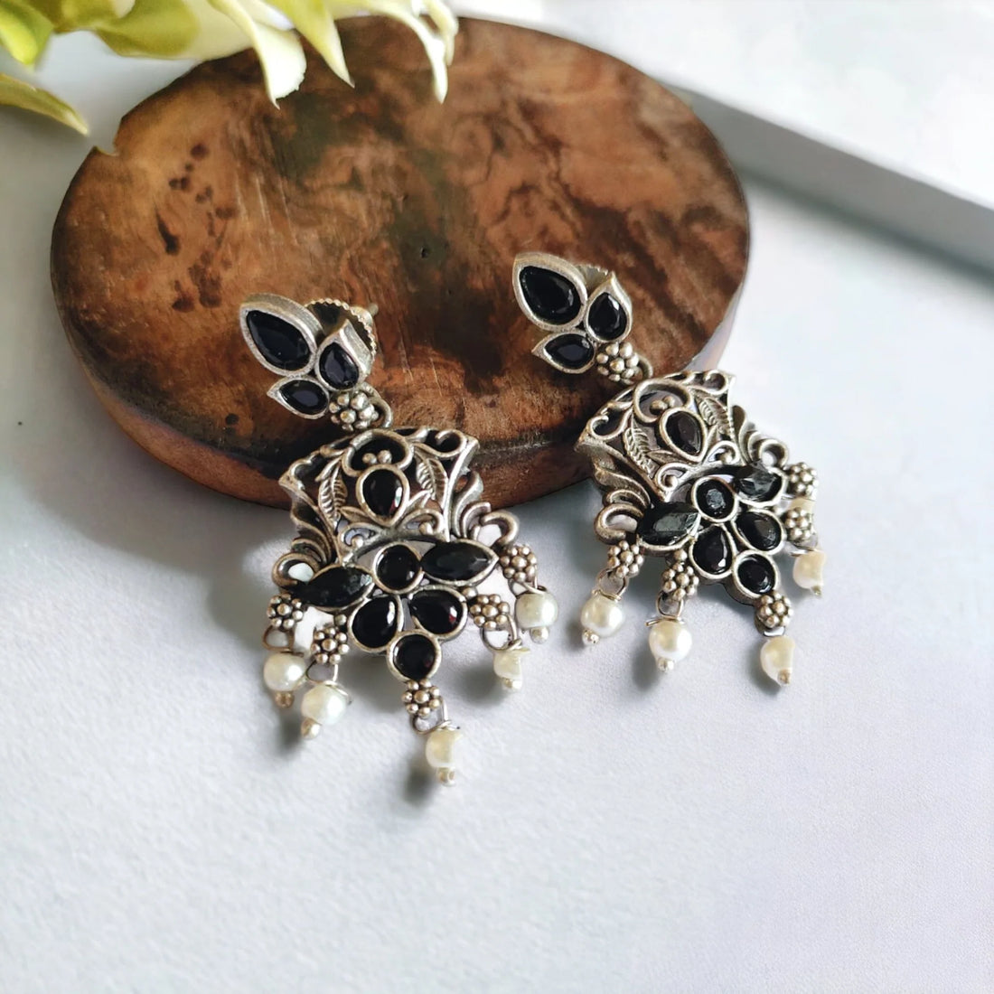 Jazbaat Oxidised Silver-Lookalike Black Stone-Studded Pearl Dangler Earrings