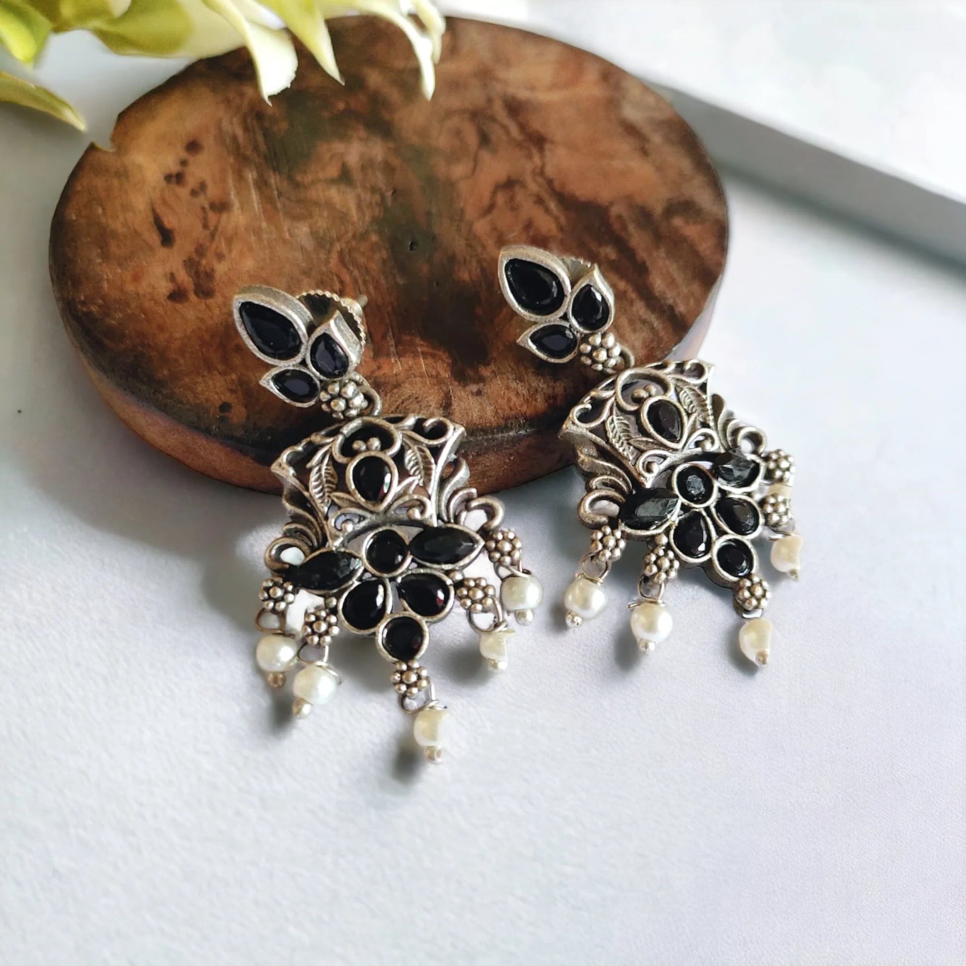 Jazbaat Oxidised Silver-Lookalike Black Stone-Studded Pearl Dangler Earrings