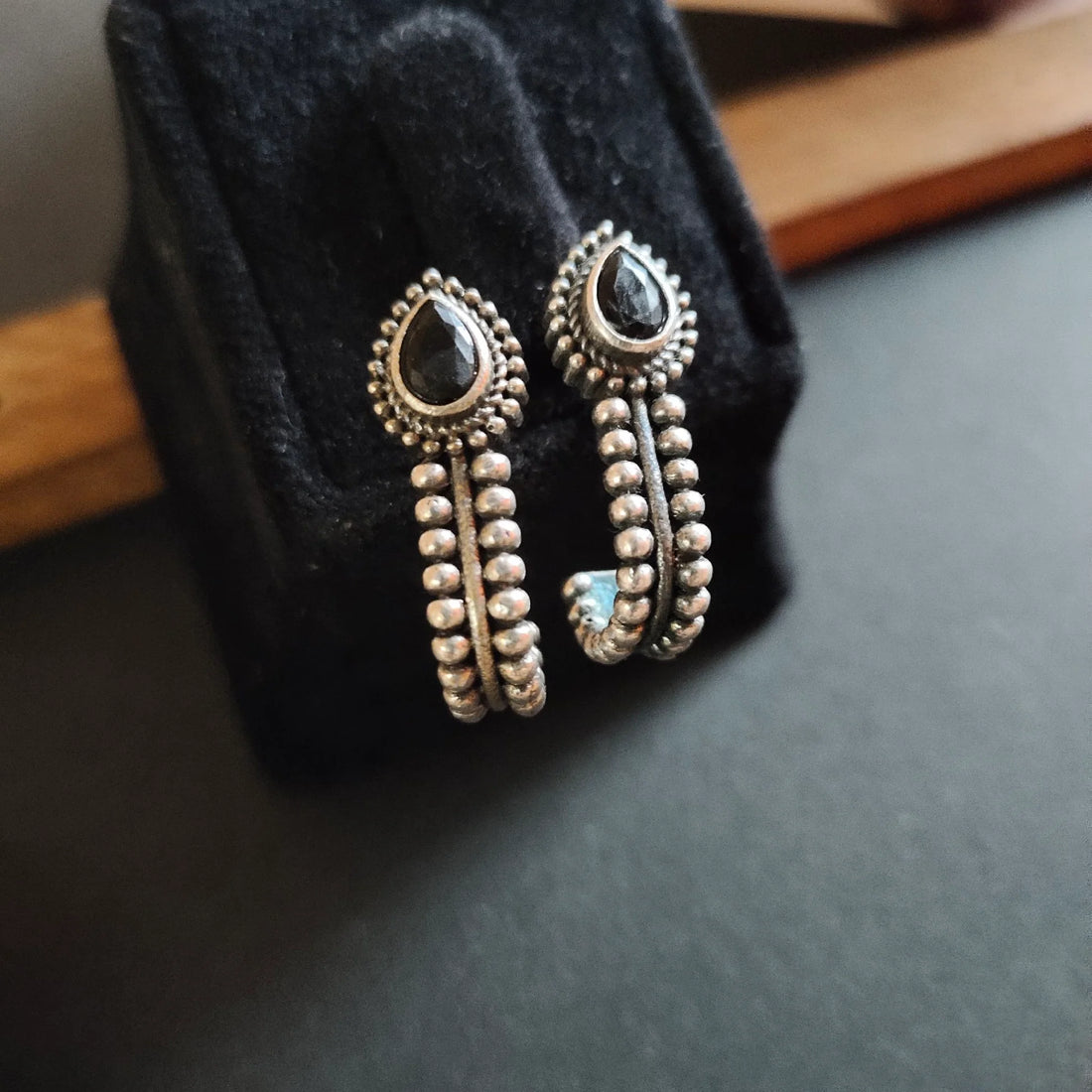 Jazbaat Silver-Plated Black Stone-Studded Oxidised Stud Earrings