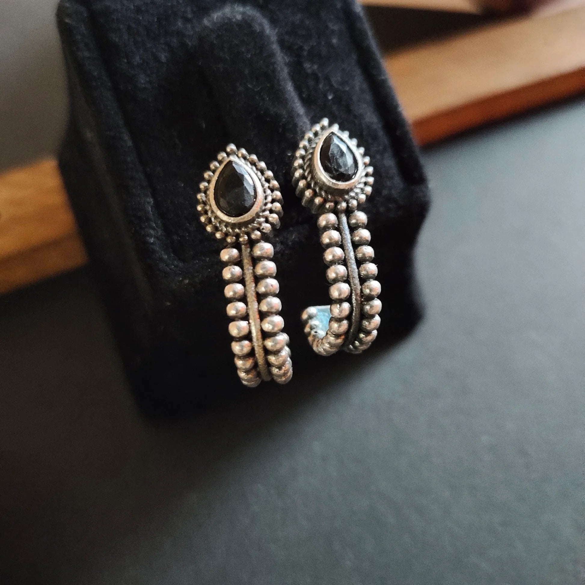 Jazbaat Silver-Plated Black Stone-Studded Oxidised Stud Earrings