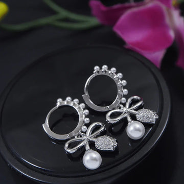 Jazbaat Silver-Plated Bowknot Design Pearl Studded Drop Earrings