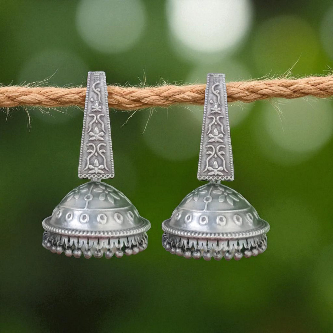 Jazbaat Silver Oxidised Dome-Shaped Antique Jhumka Earrings